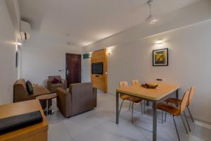 Posezení v ubytování Quality Inn Patria Suites, Rajkot