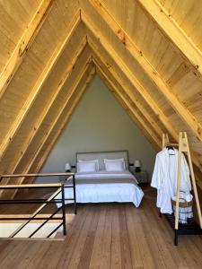 a bedroom with a bed in a roof at Sno Lake in Sno