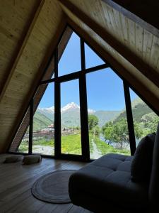 a room with a large window with a mountain view at Sno Lake in Sno