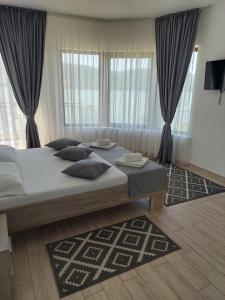 Ένα ή περισσότερα κρεβάτια σε δωμάτιο στο Casa FAVORIT