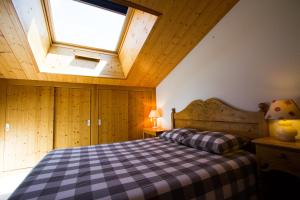 Ein Bett oder Betten in einem Zimmer der Unterkunft Appt Meije - Centre village, au calme - AravisTour