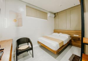 Postel nebo postele na pokoji v ubytování Lix Hotel Surigao