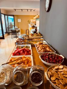 a buffet line with many different types of food at Villa White in Ksamil