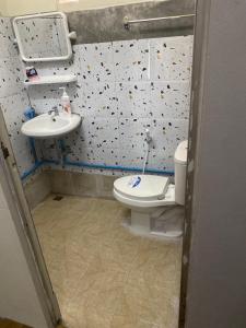 a bathroom with a toilet and a sink at Near Central Festival Hat Yai,5-8 people in Hat Yai