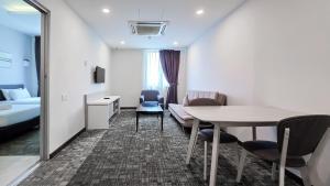 Postelja oz. postelje v sobi nastanitve Amansari Hotel Nusajaya