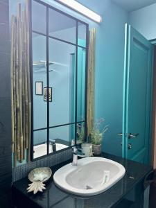 a bathroom with a sink and a large mirror at La Vista by Ronda in Eforie Sud +85 photos