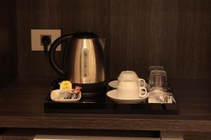 Příslušenství pro přípravu čaje a kávy v ubytování Monteverde Hotel