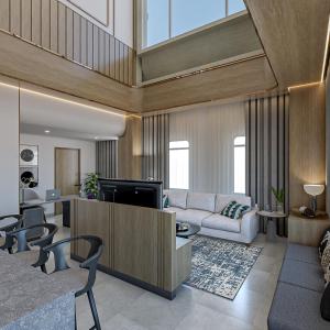 a living room with a couch and a tv at Truntum Cihampelas in Bandung