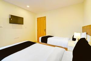 Postel nebo postele na pokoji v ubytování Hotel Cozy Cave Delhi