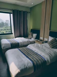 Postel nebo postele na pokoji v ubytování Hotel Cozy Cave Delhi