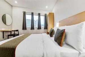 Postel nebo postele na pokoji v ubytování Hotel Cozy Cave Delhi