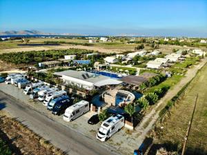an aerial view of a parking lot with buses parked at Sails on Kos Ecolux Tented Village in Marmari