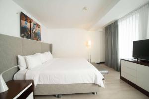 Ein Bett oder Betten in einem Zimmer der Unterkunft Radisson Hotel Decapolis Miraflores