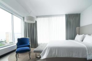 Ein Bett oder Betten in einem Zimmer der Unterkunft Radisson Hotel Decapolis Miraflores