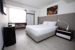 Ein Bett oder Betten in einem Zimmer der Unterkunft Radisson Hotel Decapolis Miraflores