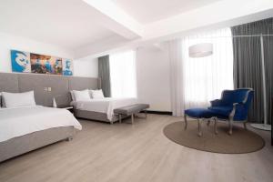Ein Bett oder Betten in einem Zimmer der Unterkunft Radisson Hotel Decapolis Miraflores