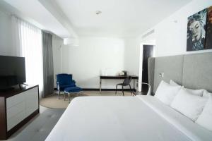 Ein Bett oder Betten in einem Zimmer der Unterkunft Radisson Hotel Decapolis Miraflores