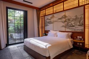 北京小湯一瓢温泉度假酒店房間的床