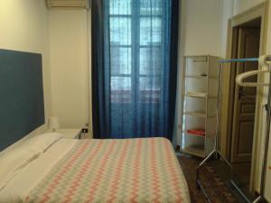 Posteľ alebo postele v izbe v ubytovaní B&B CARAVAGGIO SIRACUSA 200 Metres from Ortigia