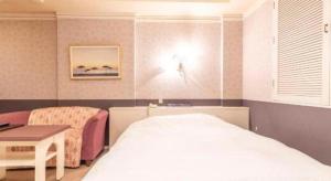 Postel nebo postele na pokoji v ubytování Tabist Hotel Please Kobe