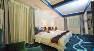 Un ou plusieurs lits dans un hébergement de l'établissement Guilin Sapphire hotel