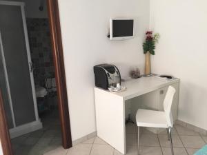 Televízia a/alebo spoločenská miestnosť v ubytovaní Residence Olbia