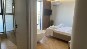 Postel nebo postele na pokoji v ubytování Hotel Parid