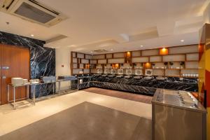 Posezení v ubytování Quality Inn Patria Suites, Rajkot