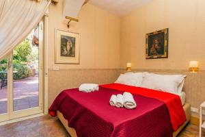 Giường trong phòng chung tại Storica Villa Taormina +24 ảnh