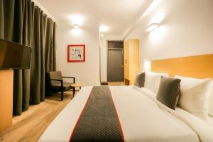 Postel nebo postele na pokoji v ubytování Hotel King Plaza