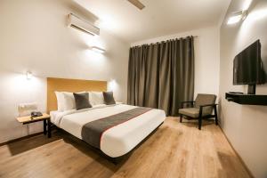 Postel nebo postele na pokoji v ubytování Hotel King Plaza