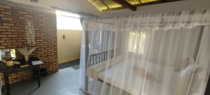 Letto o letti in una camera di Ginger Harmony Guesthouse and Cafe