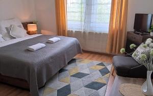 Posteľ alebo postele v izbe v ubytovaní Orient Apartmanház