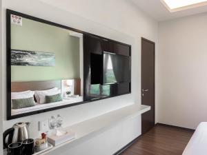 Amansari Hotel Desaru客房内的一张或多张床位