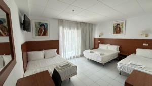 A bed or beds in a room at Hotel Sant March