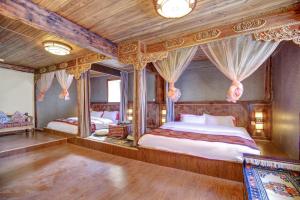 Postel nebo postele na pokoji v ubytování Shangri-La Youran Valley Inn