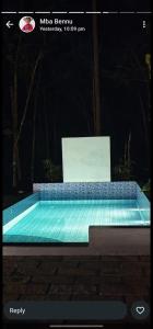 a picture of a swimming pool at night at Maryland homestay in Thattakād