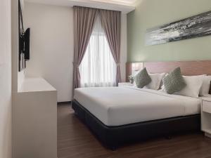 Amansari Hotel Desaru客房内的一张或多张床位