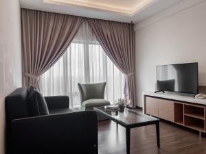 TV a/nebo společenská místnost v ubytování Amansari Hotel Desaru + 18 fotografií
