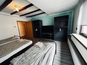 Postel nebo postele na pokoji v ubytování Pension mitten im Pfälzerwald