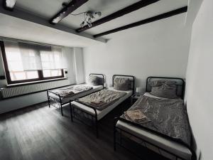 Postel nebo postele na pokoji v ubytování Pension mitten im Pfälzerwald