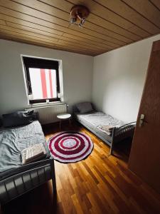 Postel nebo postele na pokoji v ubytování Pension mitten im Pfälzerwald