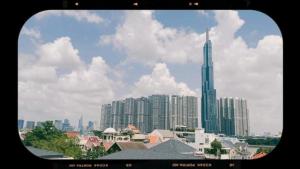 a view of a city skyline with a tall skyscraper at Nguyên Hương Hotel in Ho Chi Minh City