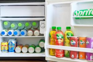 an open refrigerator filled with drinks and soda at Nguyên Hương Hotel in Ho Chi Minh City +54 photos