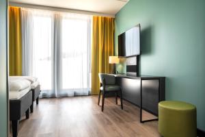 TV a/nebo společenská místnost v ubytování Thon Hotel Snø