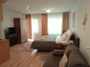 Posteľ alebo postele v izbe v ubytovaní Orient Apartmanház