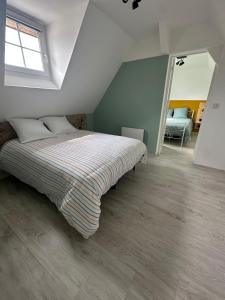 Ένα ή περισσότερα κρεβάτια σε δωμάτιο στο Appartement T3
