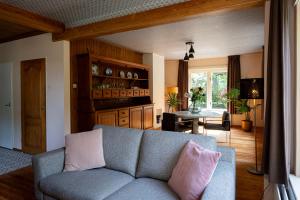 a living room with a couch and a table at Boerenvakantie in Hilversum
