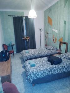 Ένα ή περισσότερα κρεβάτια σε δωμάτιο στο Chez Brigitte Guesthouse +16 φωτογραφίες