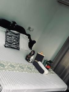 Ένα ή περισσότερα κρεβάτια σε δωμάτιο στο Orchid Cottages